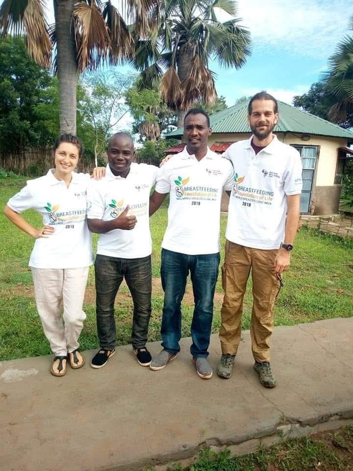 With colleagues outside a health facility