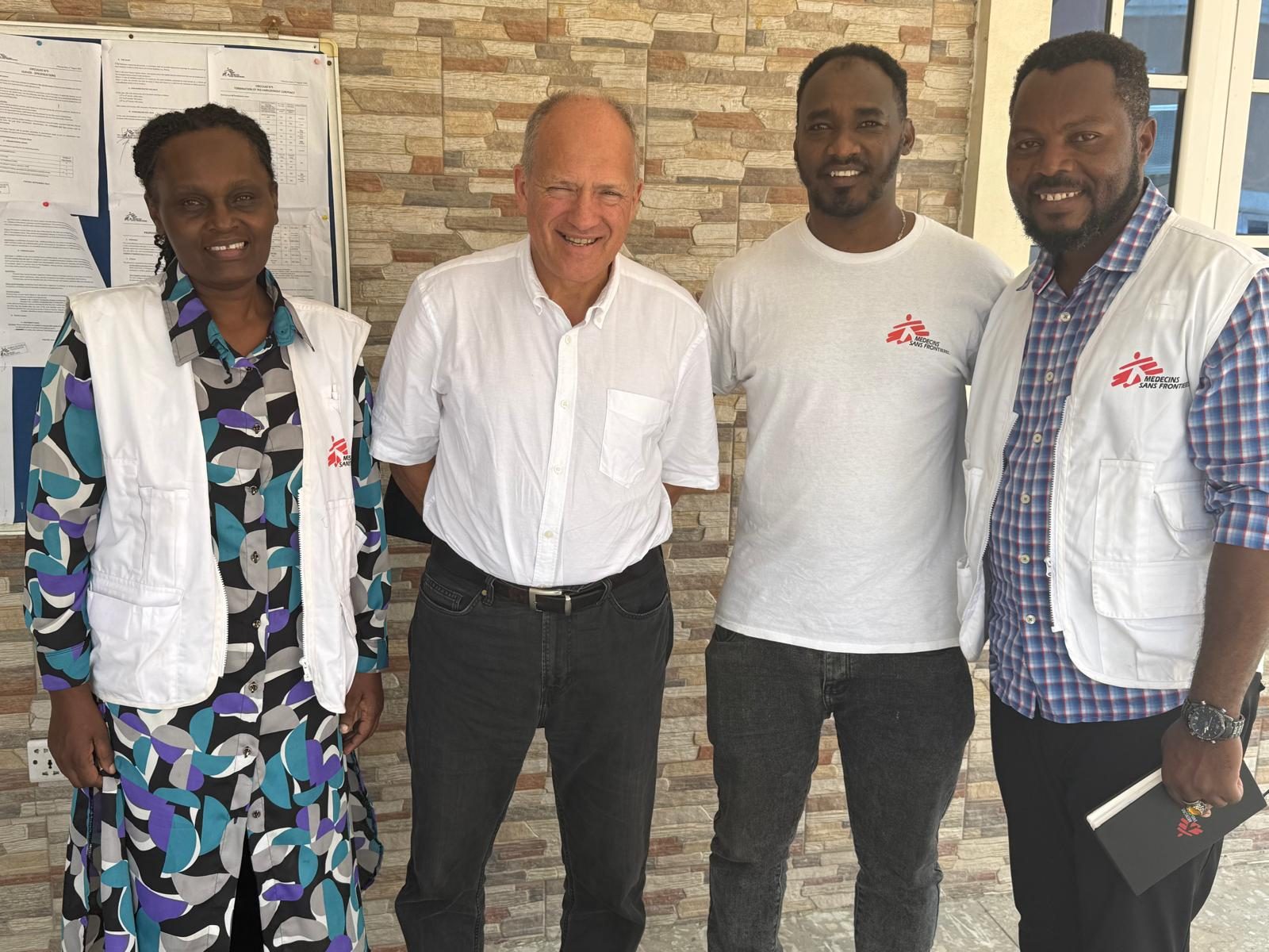 With colleagues and a visiting partner