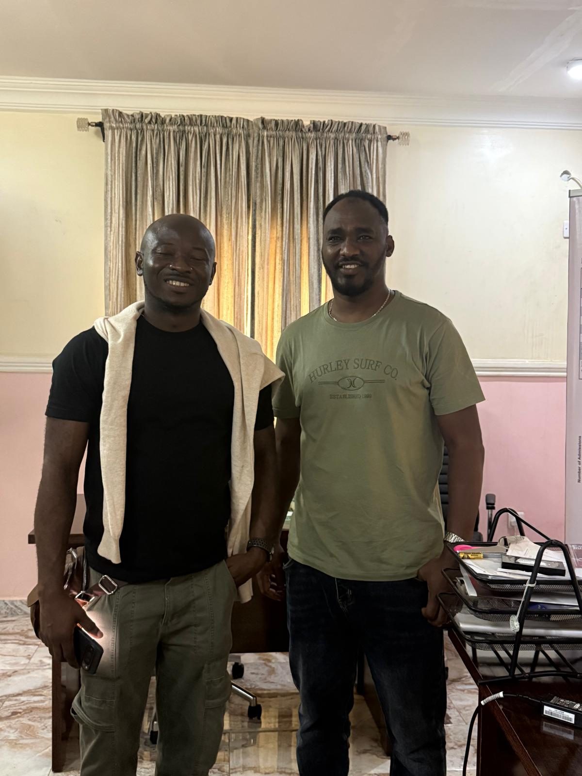 With a colleague indoors