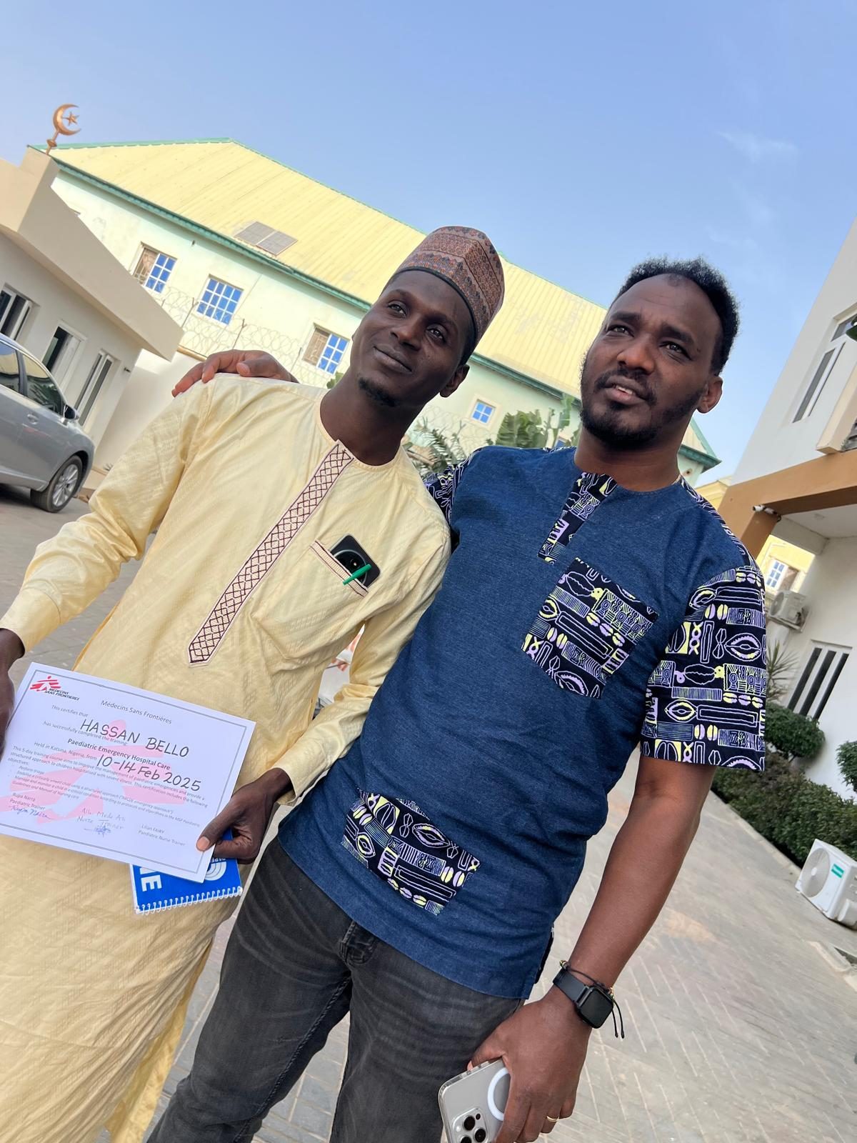 With a training participant holding a certificate